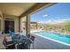 Stunning pool area with mountain views, dining area and a desert landscape at 41809 N La Crosse Trl, Anthem, AZ 85086