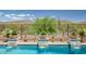 Beautiful waterfall features enhance this pool's desert-style landscaping at 41809 N La Crosse Trl, Anthem, AZ 85086