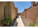 Paver walkway in the side yard is surrounded by desert landscaping at 41809 N La Crosse Trl, Anthem, AZ 85086