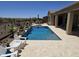 Elegant swimming pool with views of the desert, backyard patio and outdoor seating ideal for relaxation and enjoyment at 41809 N La Crosse Trl, Anthem, AZ 85086