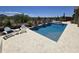 Relaxing pool and spa area with desert views, seating, and elegant landscaping creating a serene outdoor escape at 41809 N La Crosse Trl, Anthem, AZ 85086