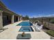 Backyard oasis featuring a swimming pool, spa, and covered patio perfect for entertaining or relaxation at 41809 N La Crosse Trl, Anthem, AZ 85086