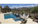 Resort-style swimming pool area for luxurious outdoor living, complete with desert views and elegant landscaping at 41809 N La Crosse Trl, Anthem, AZ 85086