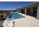 Luxury pool and spa with desert view, providing a serene escape with patio, and desert landscaping at 41809 N La Crosse Trl, Anthem, AZ 85086