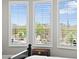 View from the bedroom windows to a pool and desert landscape at 41809 N La Crosse Trl, Anthem, AZ 85086