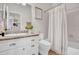 Bright and clean bathroom featuring vanity with granite countertop and shower with curtain at 4350 E Gatewood Dr, Phoenix, AZ 85050