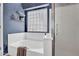 Bathroom featuring soaking tub with glass block window and a separate glass enclosed shower at 4350 E Gatewood Dr, Phoenix, AZ 85050