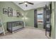 Cozy Bedroom with vaulted ceiling, ceiling fan and stylish gray crib, a comfortable haven for baby at 4350 E Gatewood Dr, Phoenix, AZ 85050