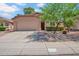 Charming single-story home with a two-car garage, attractive xeriscaping, and a well maintained lawn at 4350 E Gatewood Dr, Phoenix, AZ 85050