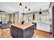 Bright kitchen features a butcher block island, modern white cabinetry, and beautiful pendant lighting at 4350 E Gatewood Dr, Phoenix, AZ 85050