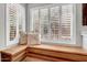 Inviting window seat with soft pillows and a view of the outside create a cozy and comfortable space at 4350 E Gatewood Dr, Phoenix, AZ 85050