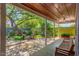 Inviting covered back patio with outdoor seating, fire pit, and a lush landscaped yard at 445 W 1St St, Mesa, AZ 85202