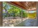 Charming back patio with outdoor seating area and shade provided by a mature tree at 445 W 1St St, Mesa, AZ 85202