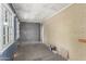 Basement space with exposed brick walls and windows, showcasing potential for customization at 445 W 1St St, Mesa, AZ 85202