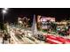 Downtown night scene in Mesa, Arizona, with modern buildings and a city train at 445 W 1St St, Mesa, AZ 85202