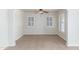 Empty dining room featuring bright windows, tile flooring, neutral walls, and natural light at 445 W 1St St, Mesa, AZ 85202