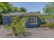 Charming single-story home with blue brick exterior and mature landscaping at 445 W 1St St, Mesa, AZ 85202