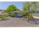 Charming single-story home with blue brick exterior and desert landscaping at 445 W 1St St, Mesa, AZ 85202