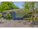 Charming single-story home with blue brick exterior, landscaped front yard at 445 W 1St St, Mesa, AZ 85202