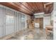 Spacious garage with exposed wood beams and an unfinished interior offering customizable potential at 445 W 1St St, Mesa, AZ 85202