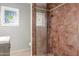 Shower stall with frameless glass doors and patterned tile at 445 W 1St St, Mesa, AZ 85202