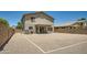 Spacious backyard with gravel, enclosed by block fence, offering easy maintenance and privacy at 45311 W Woody Rd, Maricopa, AZ 85139