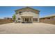 Expansive backyard featuring a covered patio and low-maintenance gravel landscaping at 45311 W Woody Rd, Maricopa, AZ 85139