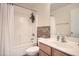 Well-lit bathroom with a shower-tub combination, a vanity with a sink, and neutral-toned walls at 45311 W Woody Rd, Maricopa, AZ 85139