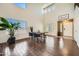 Bright dining room with vaulted ceilings, wood floors, and plenty of natural light at 45311 W Woody Rd, Maricopa, AZ 85139