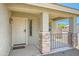 Charming front porch with stone accents on the columns and a welcoming entrance at 45311 W Woody Rd, Maricopa, AZ 85139