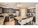 Well-equipped kitchen featuring an island with bar seating and stainless steel appliances at 45311 W Woody Rd, Maricopa, AZ 85139