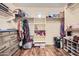 Spacious walk-in closet with custom shelving, built-in drawers and hanging storage at 45311 W Woody Rd, Maricopa, AZ 85139