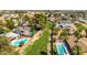 Aerial view showing houses with backyards, pools, fences, and mature landscaping at 5127 E Tamblo Dr, Phoenix, AZ 85044