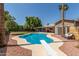 Backyard features a sparkling pool and outdoor seating at 5127 E Tamblo Dr, Phoenix, AZ 85044