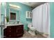 This bathroom features vanity sink, toilet, and shower at 5127 E Tamblo Dr, Phoenix, AZ 85044