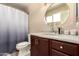 This is a bathroom featuring a vanity sink, toilet, and shower at 5127 E Tamblo Dr, Phoenix, AZ 85044