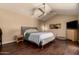 Serene bedroom with hardwood floors, a ceiling fan, and minimalist decor at 5127 E Tamblo Dr, Phoenix, AZ 85044