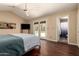 The bedroom features French doors leading to the backyard and pool, and a doorway to the bathroom at 5127 E Tamblo Dr, Phoenix, AZ 85044
