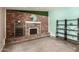 Charming bonus room showcasing a brick fireplace, shelving, and a decorative mirror at 5127 E Tamblo Dr, Phoenix, AZ 85044