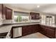 Well-lit kitchen equipped with stainless steel appliances and ample counter space at 5127 E Tamblo Dr, Phoenix, AZ 85044