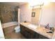 Bathroom featuring a vanity with a granite countertop, bathtub, and tiled shower at 5345 E Van Buren St # 115, Phoenix, AZ 85008
