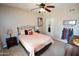 Cozy bedroom with a comfortable bed, ceiling fan, and tasteful décor, offering a relaxing private retreat at 5345 E Van Buren St # 115, Phoenix, AZ 85008