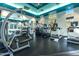 Well-equipped gym with modern cardio machines, weightlifting equipment, and natural light, promoting a healthy lifestyle at 5345 E Van Buren St # 115, Phoenix, AZ 85008