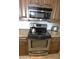 Stainless steel stove, oven, and microwave in the kitchen at 5345 E Van Buren St # 115, Phoenix, AZ 85008
