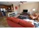 Open-concept living space with modern decor, including a comfortable sofa and stylish furnishings at 5345 E Van Buren St # 115, Phoenix, AZ 85008