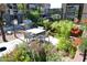 Inviting outdoor dining area with a grill, a table, and lush landscaping for relaxing and enjoying outdoor meals at 5345 E Van Buren St # 115, Phoenix, AZ 85008