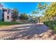 Community sand volleyball court offers a fun recreational amenity surrounded by well-maintained grounds and mature trees at 5345 E Van Buren St # 115, Phoenix, AZ 85008