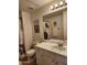 Bathroom featuring a white vanity with a white marble countertop at 5345 E Van Buren St # 116, Phoenix, AZ 85008