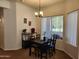 Charming dining area with a modern black table and chairs, perfect for intimate gatherings at 5345 E Van Buren St # 116, Phoenix, AZ 85008