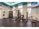 Community gym with multiple weight machines and a flatscreen TV at 5345 E Van Buren St # 116, Phoenix, AZ 85008